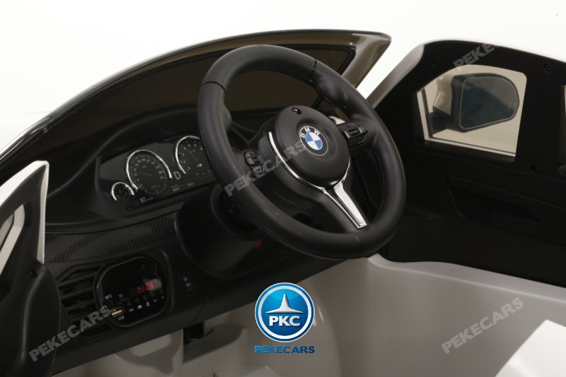 Coche electrico para niños BMW X6M Negro Metalizado detalles del interior